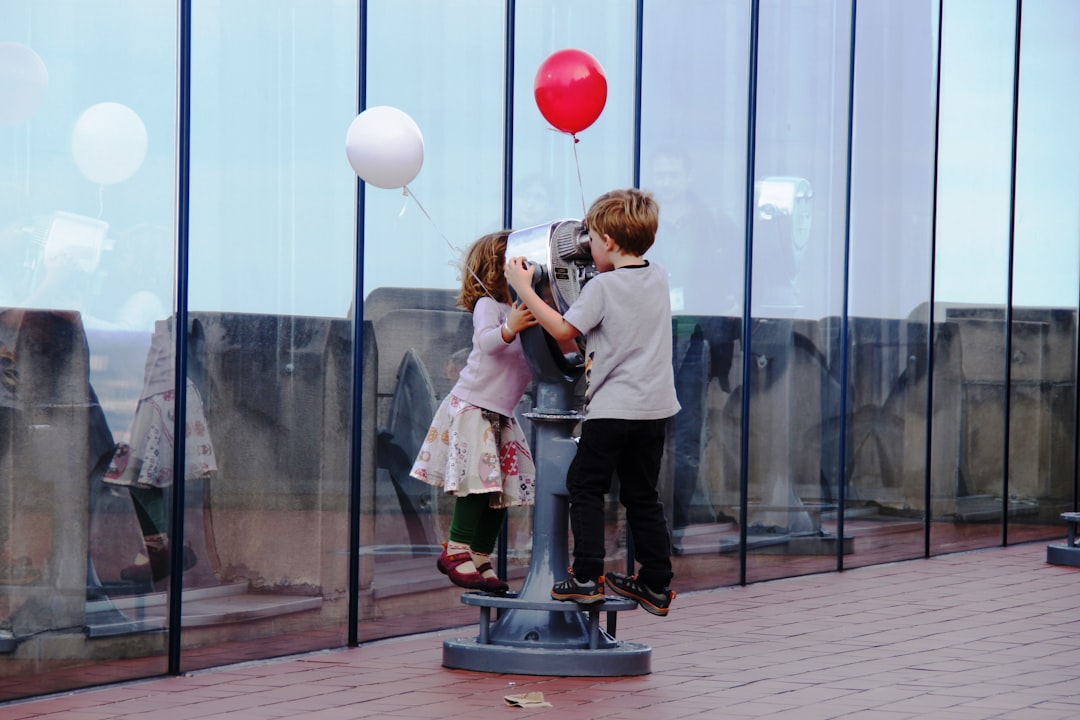 children explore a hands-on exhibit together, enjoying rainy day activities for kids in New York City
