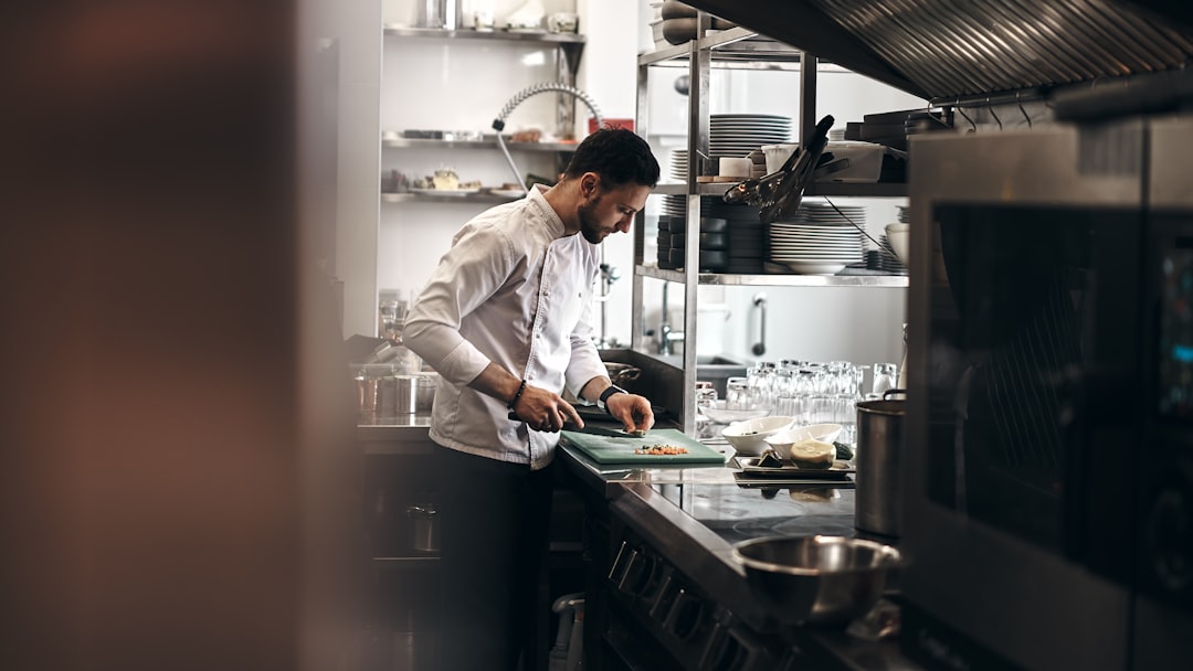A food entrepreneur preparing products in a shared commercial kitchen space in New York City
