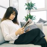 A woman reviewing a lease agreement as NYC rents continue to rise in a Manhattan apartment building