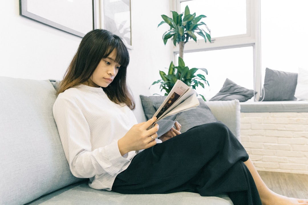 A woman reviewing a lease agreement as NYC rents continue to rise in a Manhattan apartment building