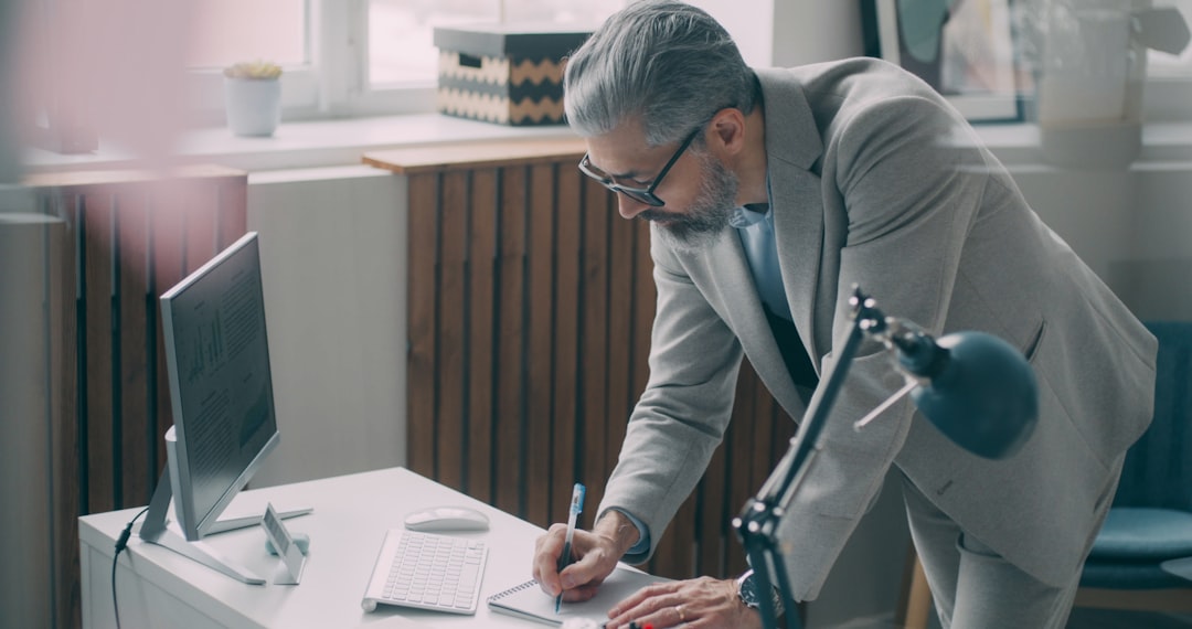 A first-time business owner reviewing a commercial lease agreement at a desk in a New York City office