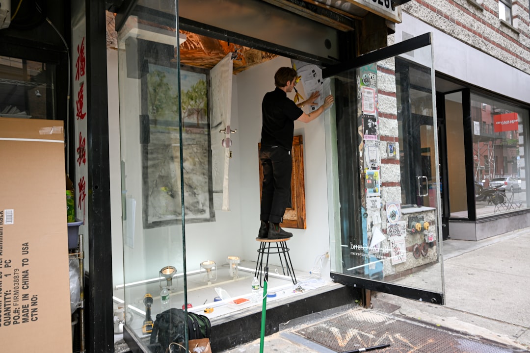 A painter working at an easel in a New York studio space, representing the focused time that artist residencies provide.