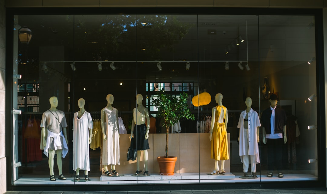 A focused entrepreneur arranging products inside a pop-up retail space in New York City