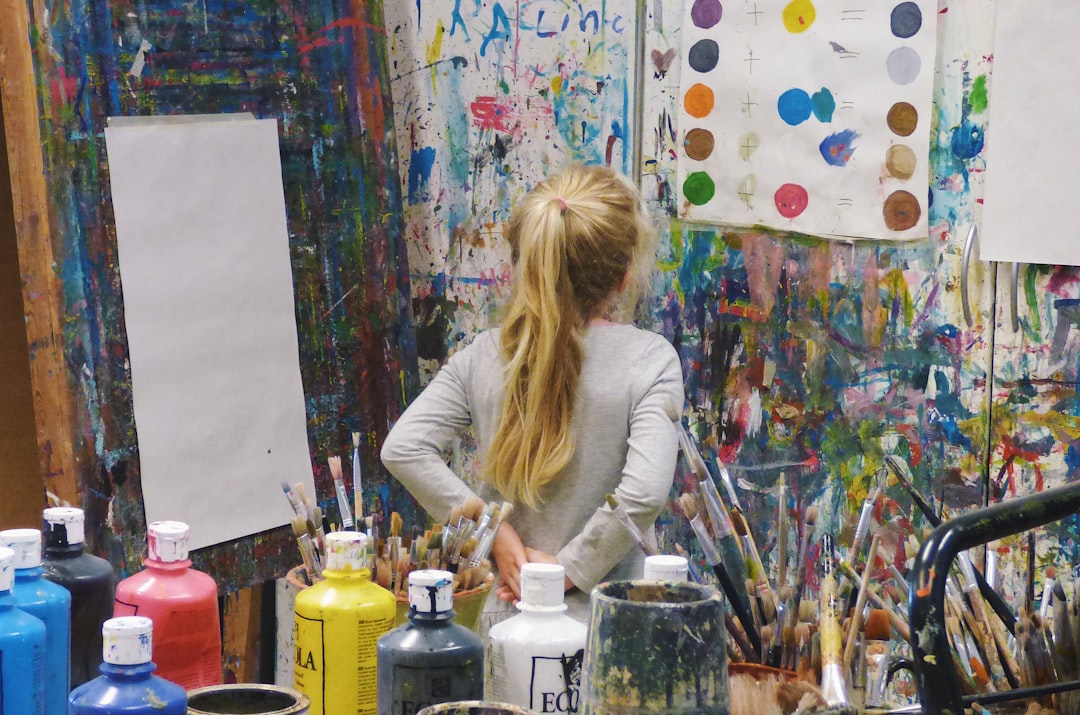 A young child painting on canvas in an after-school programmes art studio in New York City