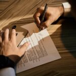 A New York City founder reviews an NDA document to protect a business idea before a pitch meeting
