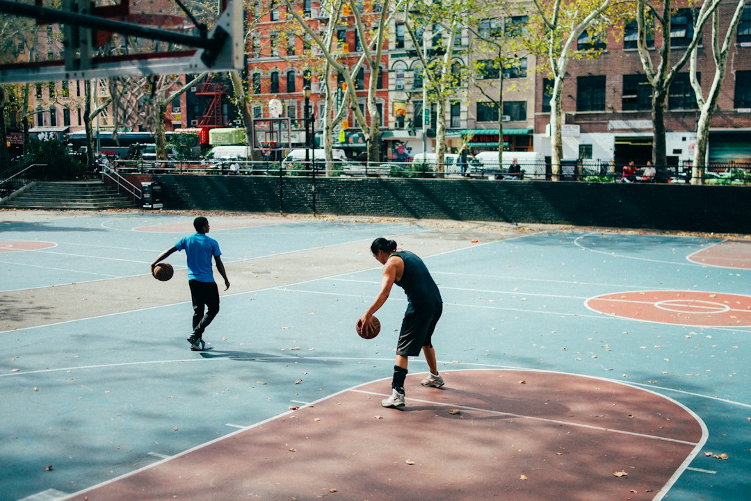 Players in a pickup basketball game at the West 4th Street cage